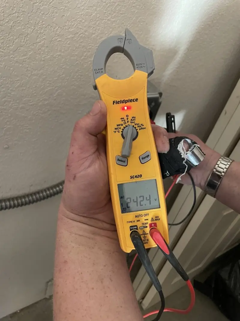 Voltage testing with clamp meter during Whole House Surge Protector in Superior